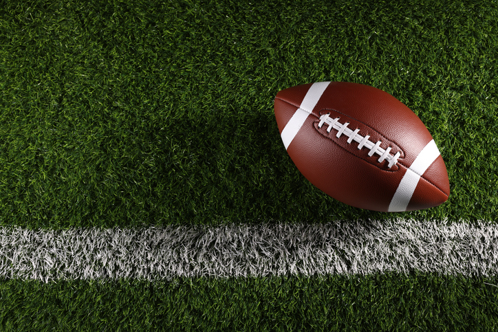 American football on football field background iStock