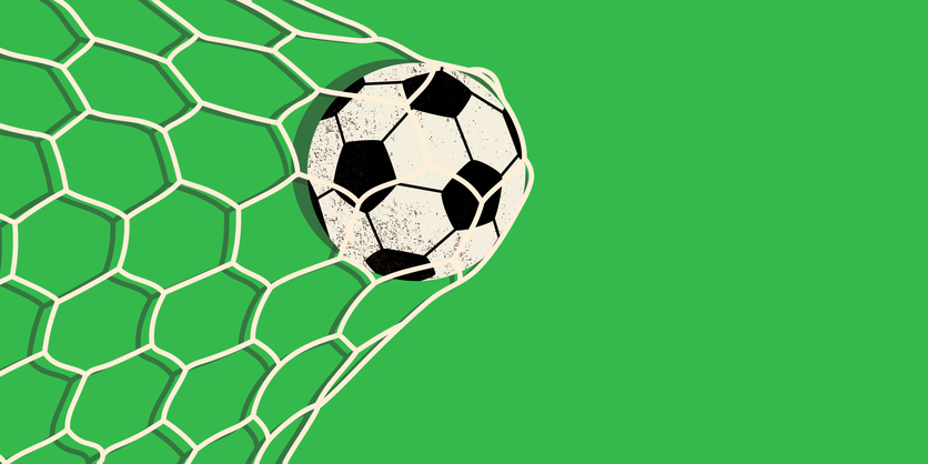Soccer ball hitting the net and scoring a goal. iStock
