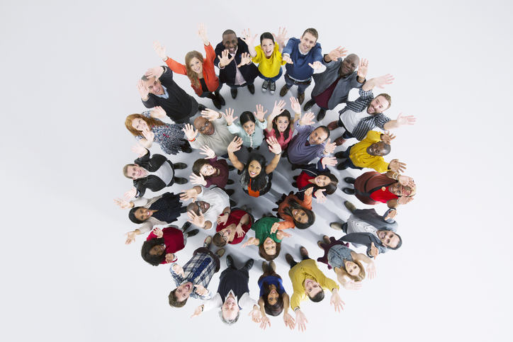 Portrait of enthusiastic business people in circle iStock